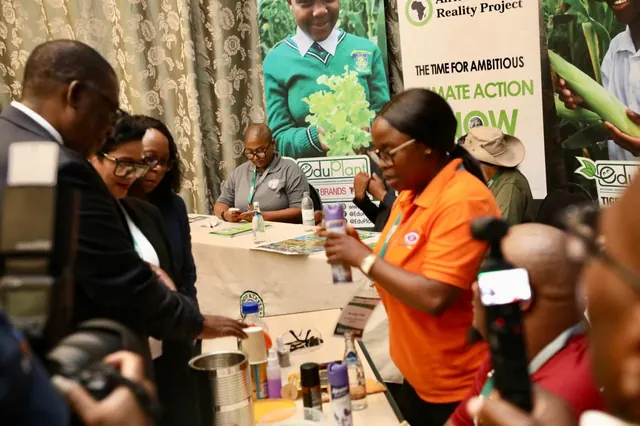 An exhibitor demonstrating a schools gardening project at the EduPlant stand