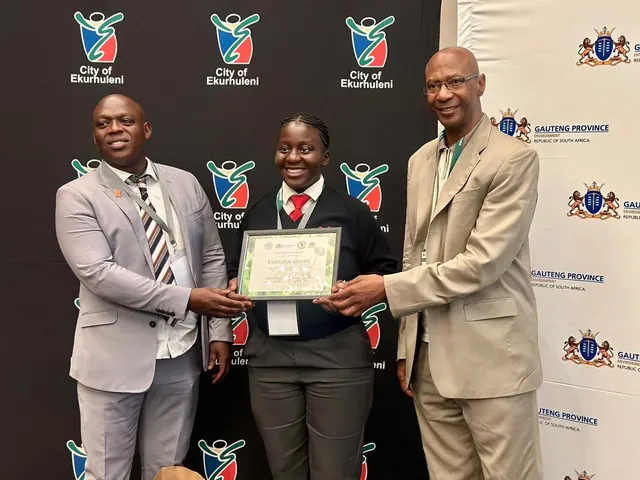 A learner receiving a certificate from provincial officials at a City of Ekurhuleni event